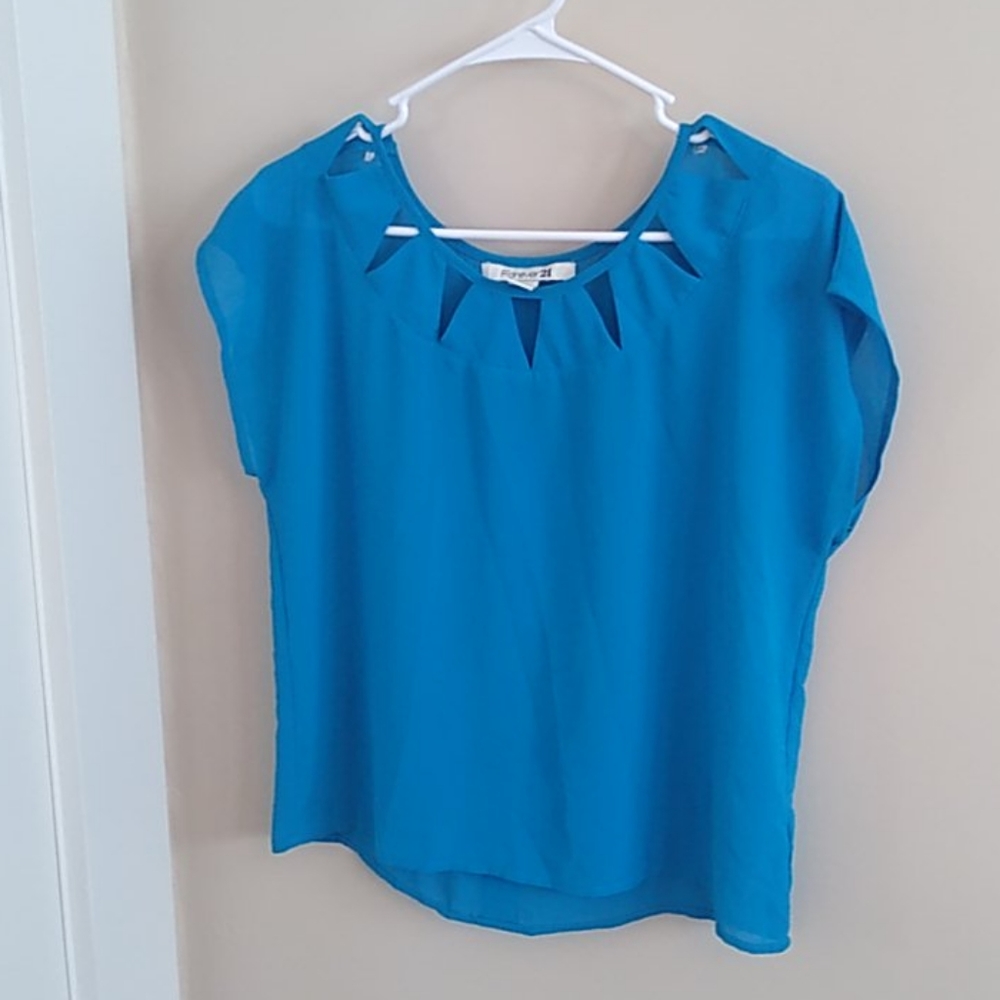 Bright blue top with cut-outs
